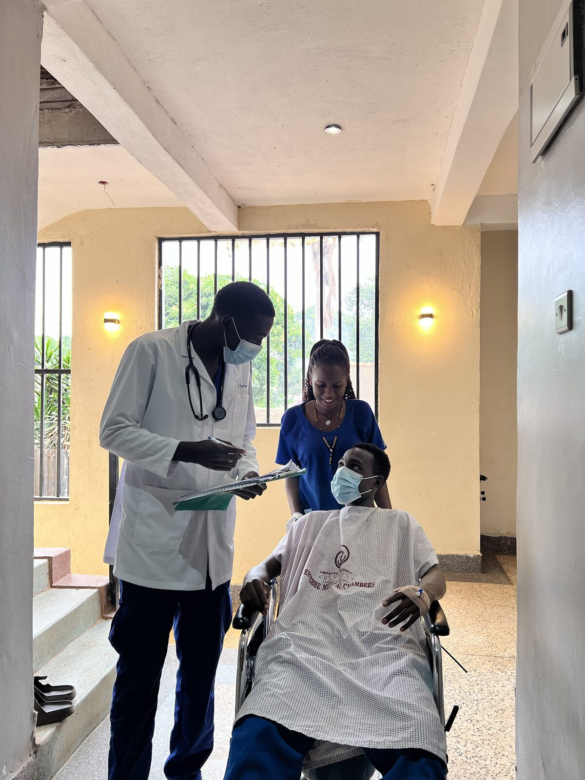 Doctor and nurse following up with a patient at Entebbe Medical Chambers